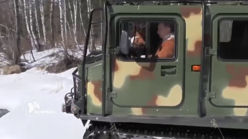 Russian pres. driving a military vehicle