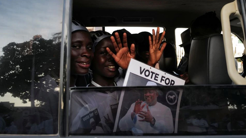 Supporters of Gambia’s President and presidential candidate Adama Barrow celebrate after partial results of the presidential elections showed Barrow leading in Banjul, Gambia, December 5, 2021. REUTERS/Zohra Bensemra