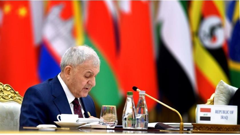 Iranpress: الرئيس العراقي يشيد بمواقف الشهيدين سليماني والمهندس 