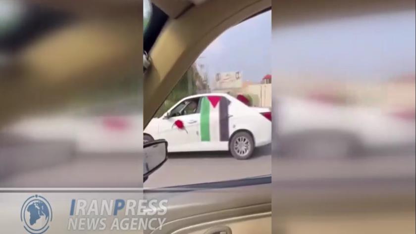 Iranpress: ماشین عروسی که با پرچم فلسطین تزئین شده در اهواز