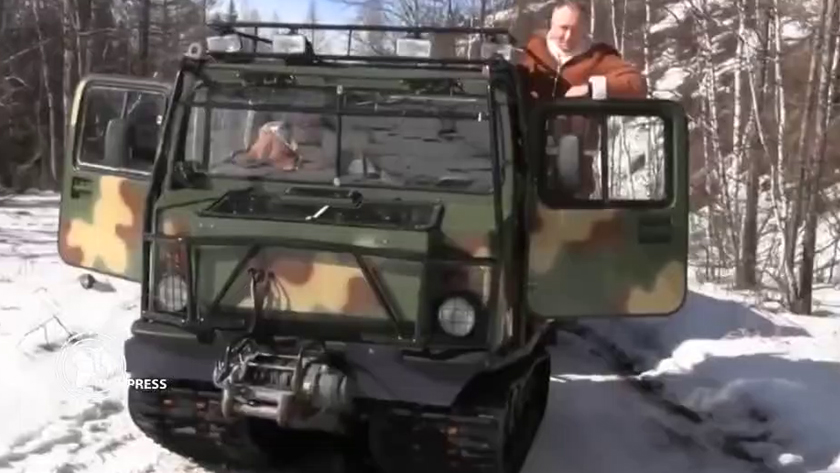 Russian pres. driving a military vehicle