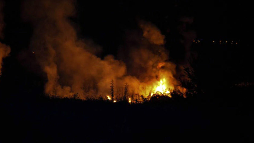 Flames rise at the crash site of an Antonov An-12 cargo plane owned by a Ukrainian company, near Kavala, Greece, July 16, 2022. Laskaris Tsotsas/Eurokinissi via REUTERS