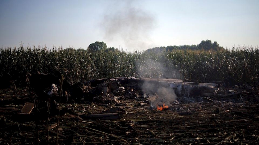 Debris burns at the crash site of an Antonov An-12 cargo plane owned by a Ukrainian company, near Kavala, Greece, July 17, 2022. REUTERS/Alkis Konstantinidis