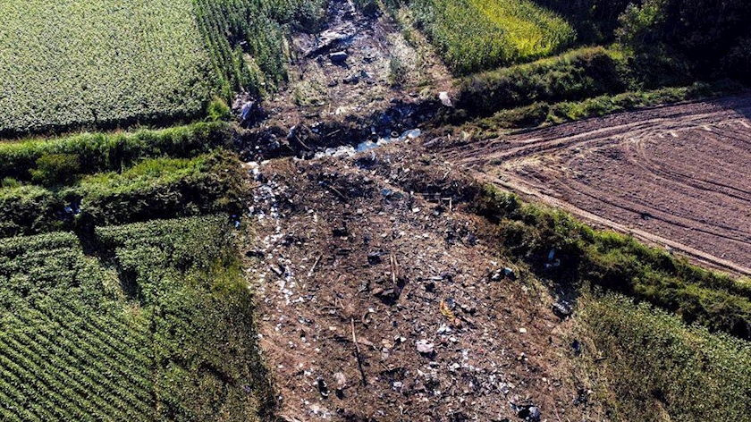 Debris burns at the crash site of an Antonov An-12 cargo plane owned by a Ukrainian company, near Kavala, Greece, July 17, 2022. REUTERS/Alkis Konstantinidis