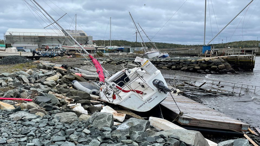A sailboat lies washed up on shore following the passing of Hurricane Fiona, later downgraded to a post-tropical storm, in Shearwater, Nova Scotia, Canada September 24, 2022. REUTERS/Eric Martyn