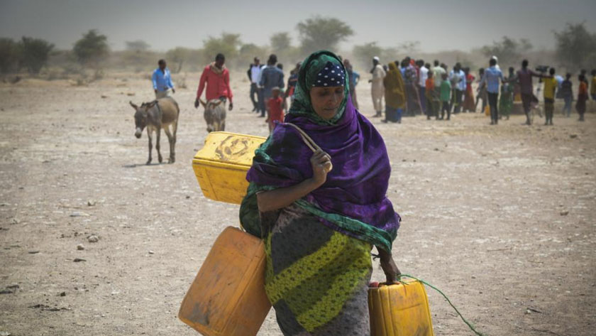 The file photo shows a woman carries jerrycans in Ethiopia