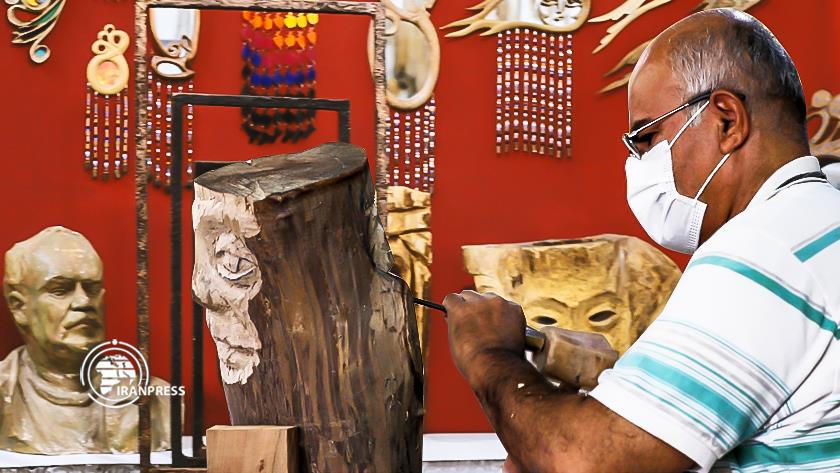 Iranpress: Iranian Kurdish artist creativity shines in wood art 