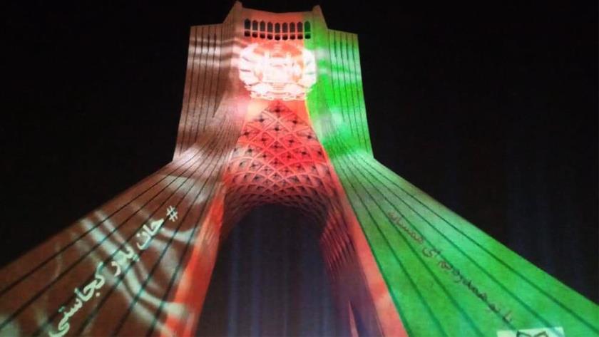 Iranpress: Sympathy with Afghans, Tehran’s Azadi Tower lit up  