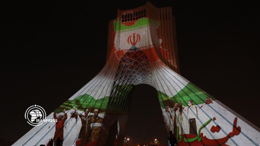Iranpress: Solidarity of Iranian nation appears on Tehran Azadi Tower in images