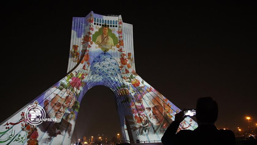 Iranpress: Portrait of resistance martyrs shown on Azadi Tower in Tehran