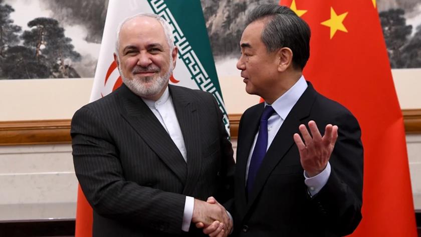 Iranpress: China and Iranian FM meet and open Diplomatic Document Expo