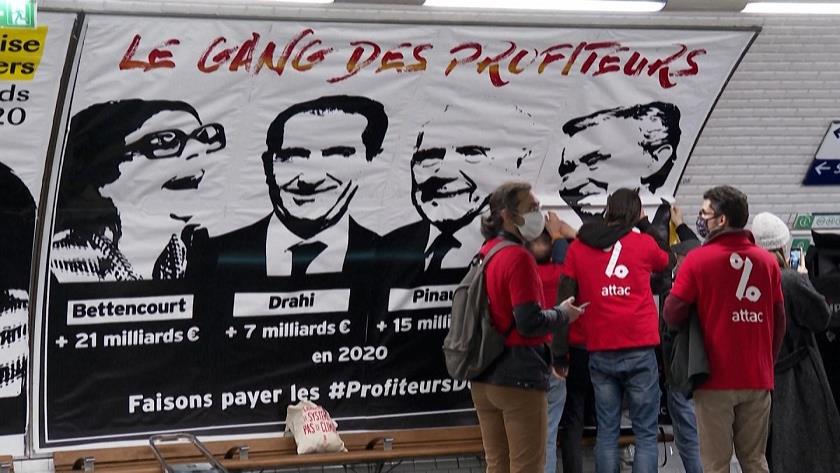 Iranpress: Activists protest in Paris against profiteers of COVID pandemic