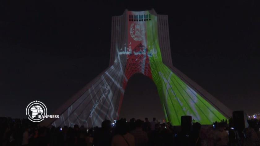 Iranpress: Lighting the Afghan flag on the Azadi Tower to express sympathy