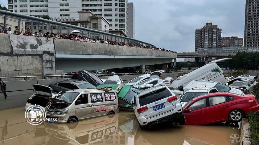 Iranpress: Heavy floods in China traps passengers inside submerged subway