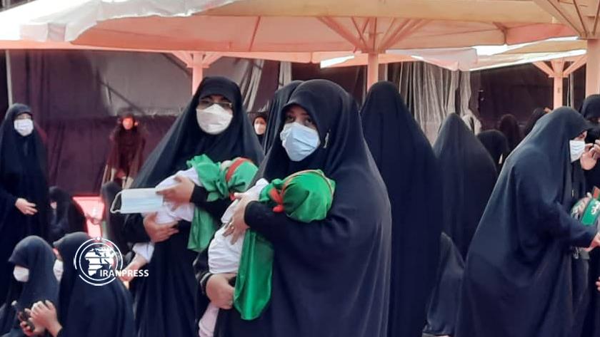 Iranpress: Iranian mothers renew allegiance with Imam Hussein at Muharram