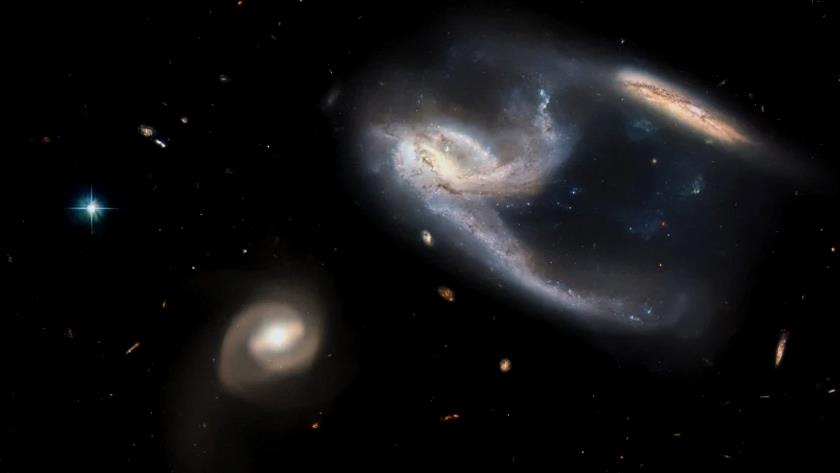 Iranpress: Hubble telescope shares stunning photo of three galaxies interacting with each other
