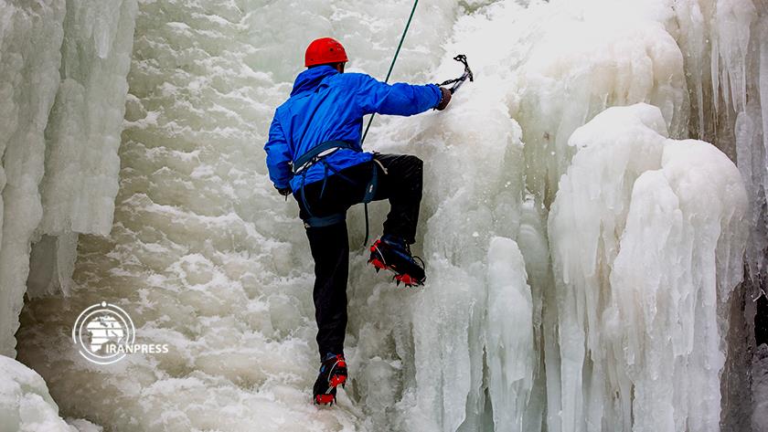 Iranpress: Ice climbing in Ganjnameh waterfall, Hamedan