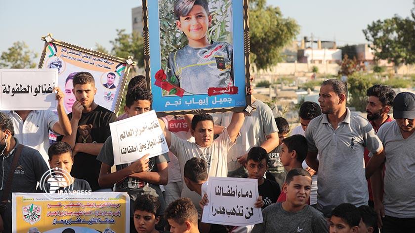 Iranpress: Gazan protesters demand trial of Israeli child-killing regime 