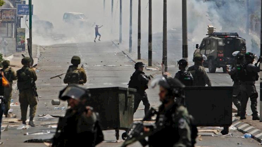 Iranpress: 37 Palestinians injured in West Bank clashes: medics