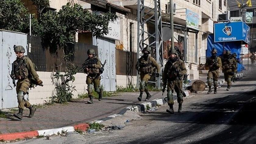 Iranpress: Israeli forces attack different areas of Jenin