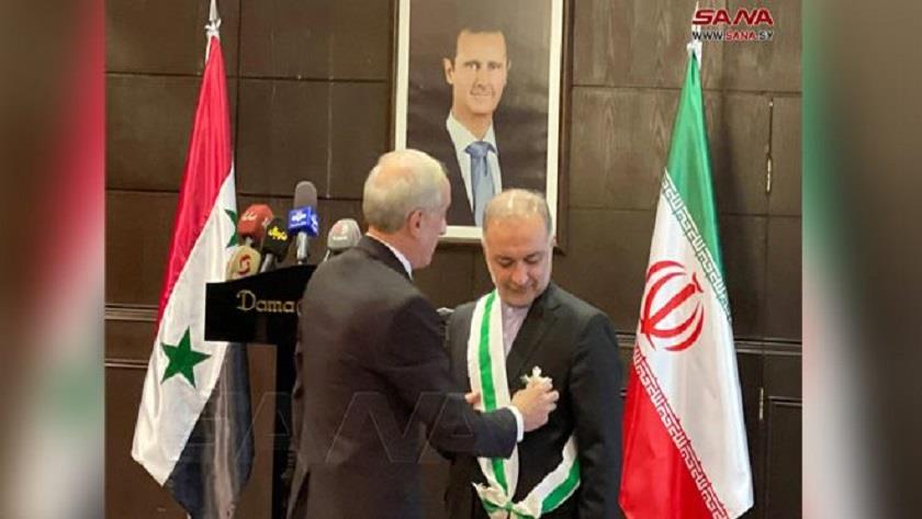 Iranpress: Bashar Al-Assad awards Syrian Order of Merit to Iranian ambassador