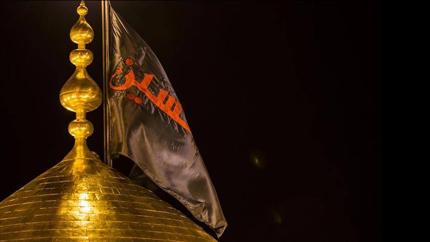 Iranpress: Imam Hussain shrine hoist mourning flag for Muharram