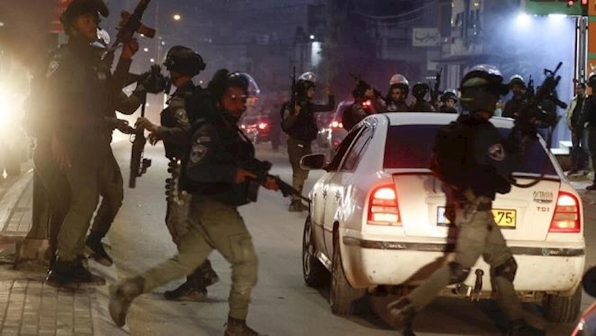 Iranpress: Palestinian teen killed as Israeli forces raid Qalqiliya