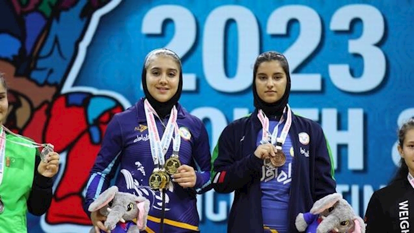 Iranpress: Iranian women weightlifters shine in Asian Youth Weightlifting C