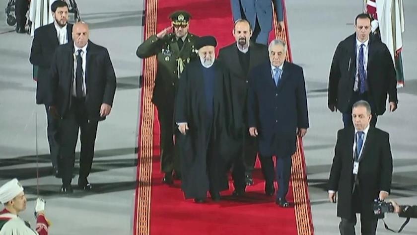 Iranpress: Iran President arrives in Algeria, welcomed by counterpart