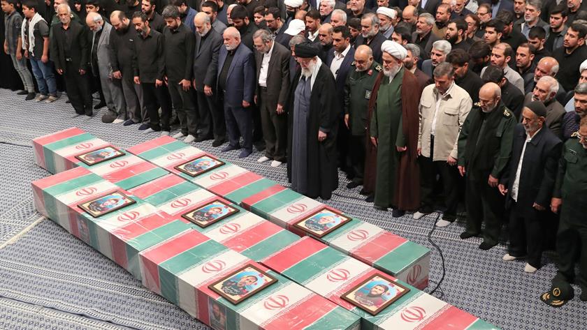 Iranpress: Iran Leader participates in funeral prayer for martyred commanders