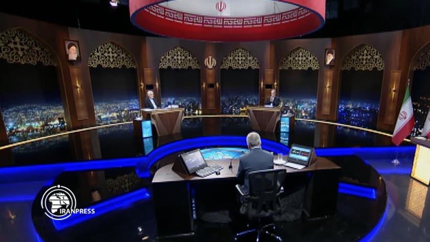 Iranpress: Two Presidential Candidates Present Their Opinions in Debate