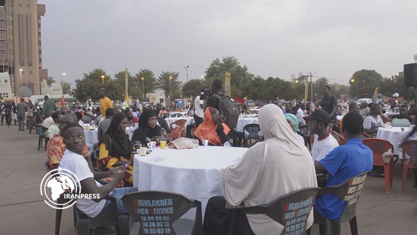 Iranpress: Muslims, Christians in Burkina Faso Share Iftar to Promote Unity 