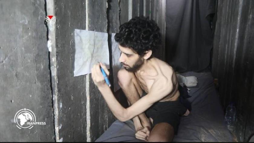 Iranpress: Qassam Brigades: Captives Eat What We Eat