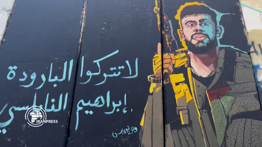 Iranpress: Une peinture du commandant martyr palestinien sur le mur de l