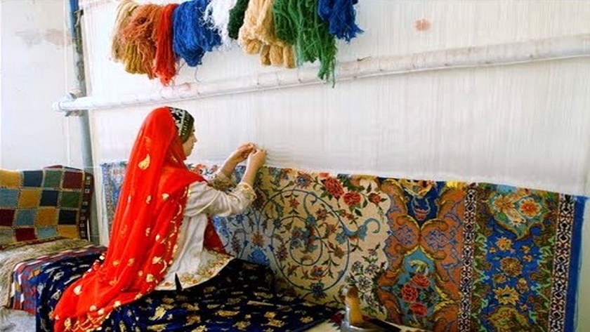 Iranian woman weaving carpet 